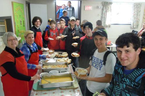 Sydenham High School students line up for their first free Lunch4Teens meal at St,. Paul's Anglican church in Sydenham on November 12.